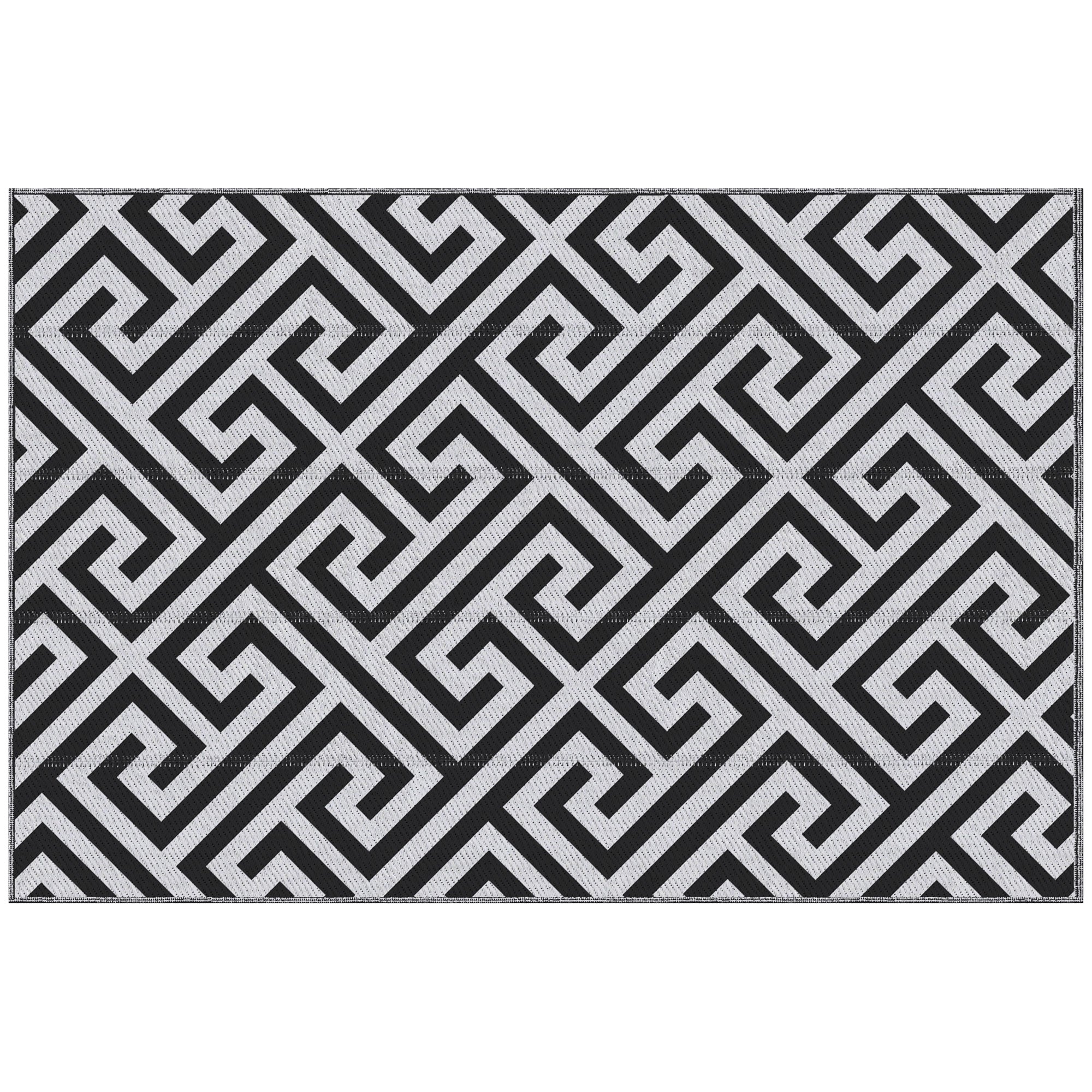 Black and white geometric patterned rug on a white background