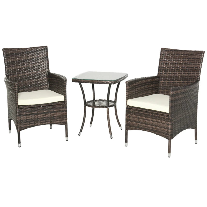 Wicker outdoor furniture set with two chairs and a table on a white background