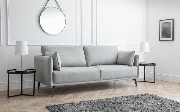 Gray sofa in a modern living room with minimal decor