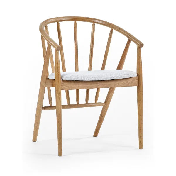 Wooden chair with a grey cushion on a white background