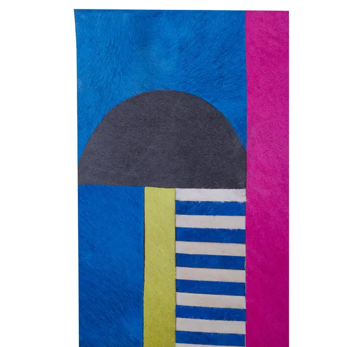 Colorful geometric patterned towel with blue, pink, gray, yellow, and striped sections on a white background.