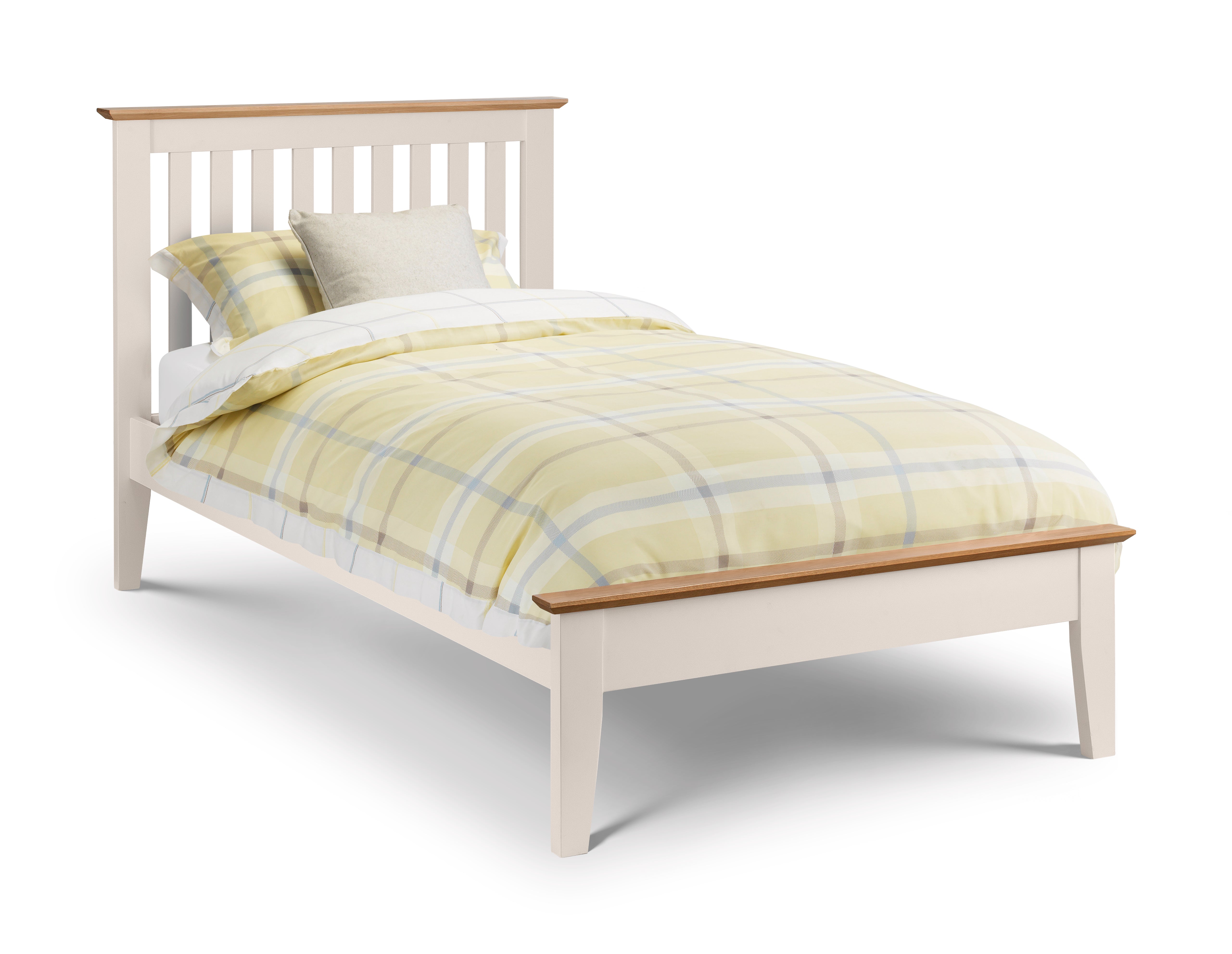 Bed with yellow plaid bedding on a white background