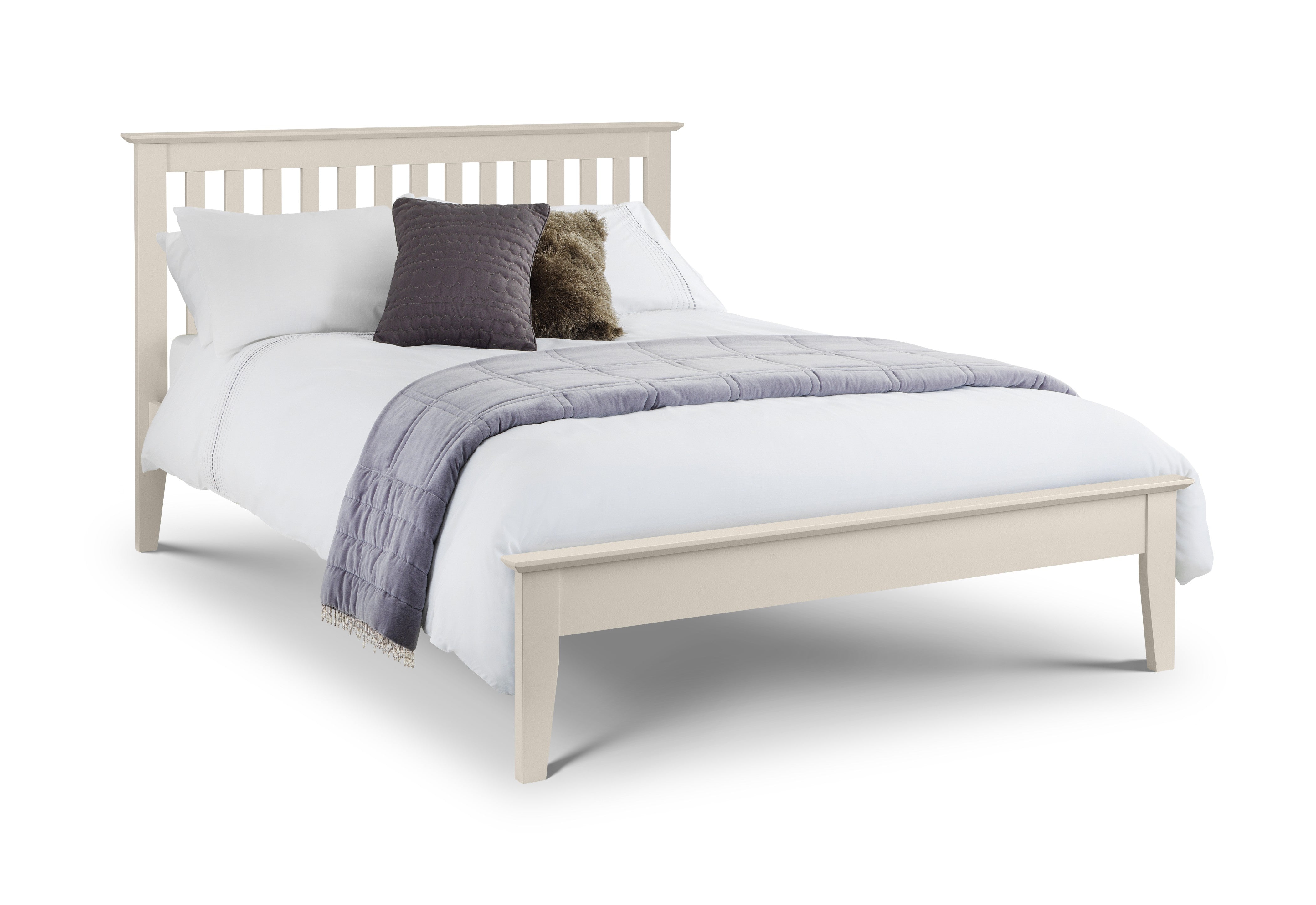 Beige wooden bed with white bedding and decorative pillows on a white background