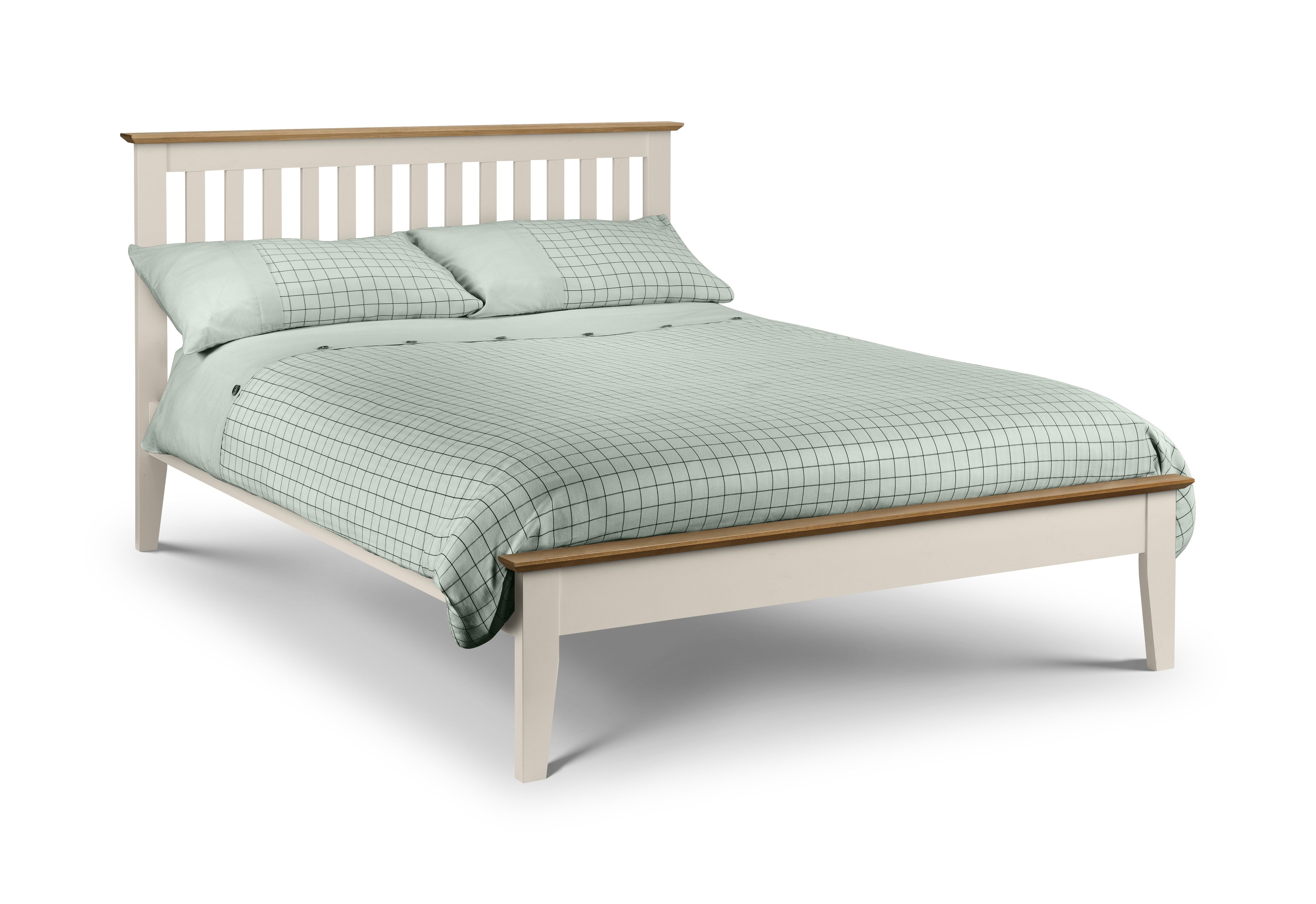 Bed with white frame and wooden accents, covered with green checkered bedding on a white background