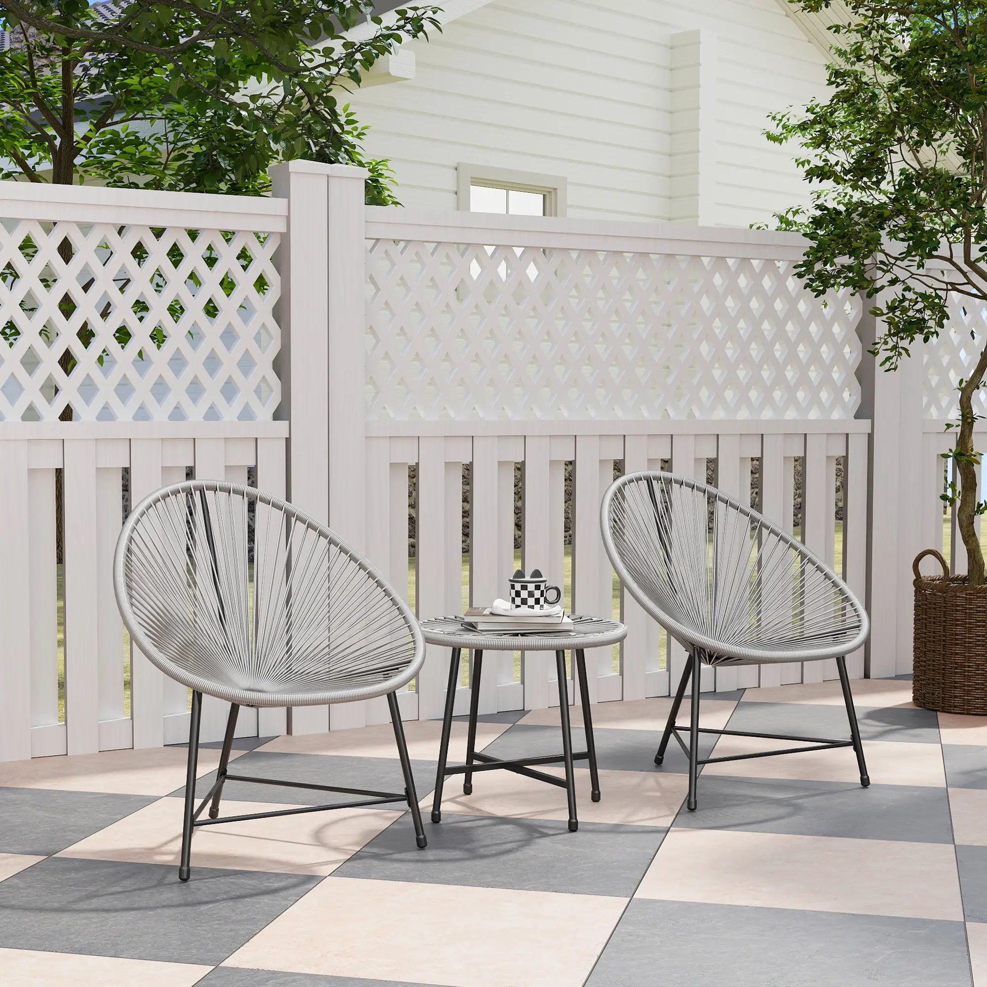 Outdoor patio set with two chairs and a small table on a checkered patio floor.