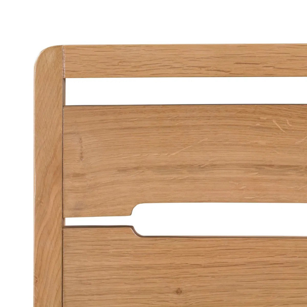 Wooden headboard with a white rectangular object on a white background