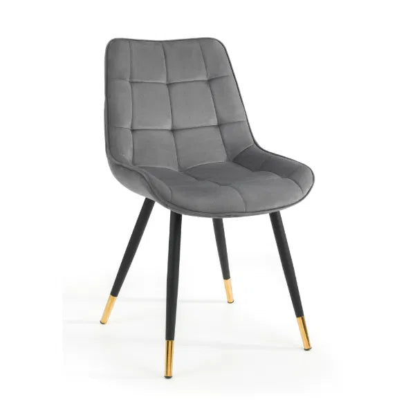 Gray upholstered chair with black legs and gold accents on a white background