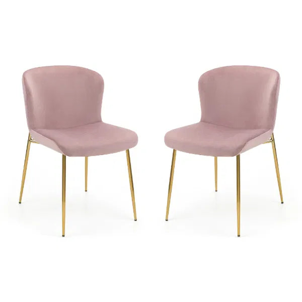 Two pink chairs with gold legs on a white background