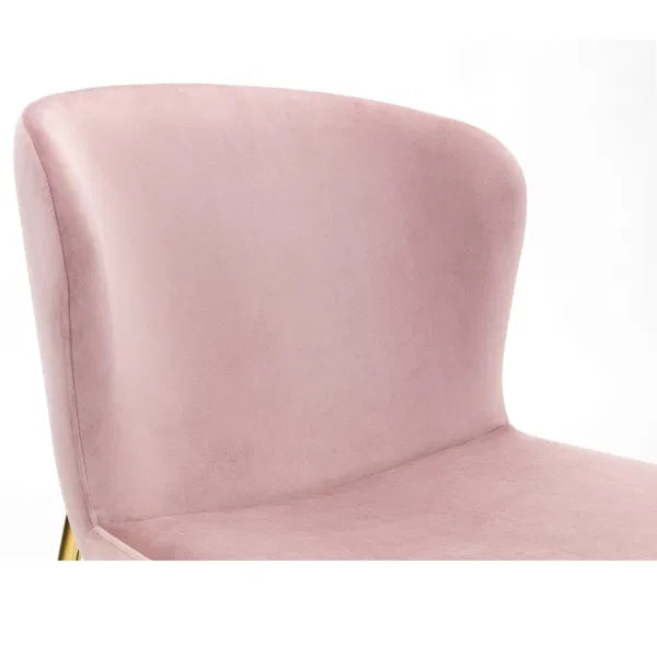 Pink velvet chair on a white background