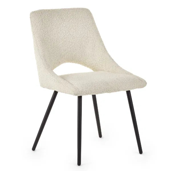 Beige upholstered chair with black legs on a white background