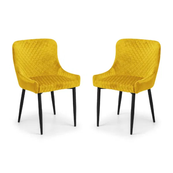 Two yellow chairs with quilted design on a white background