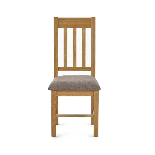 Wooden chair with a gray cushion on a white background