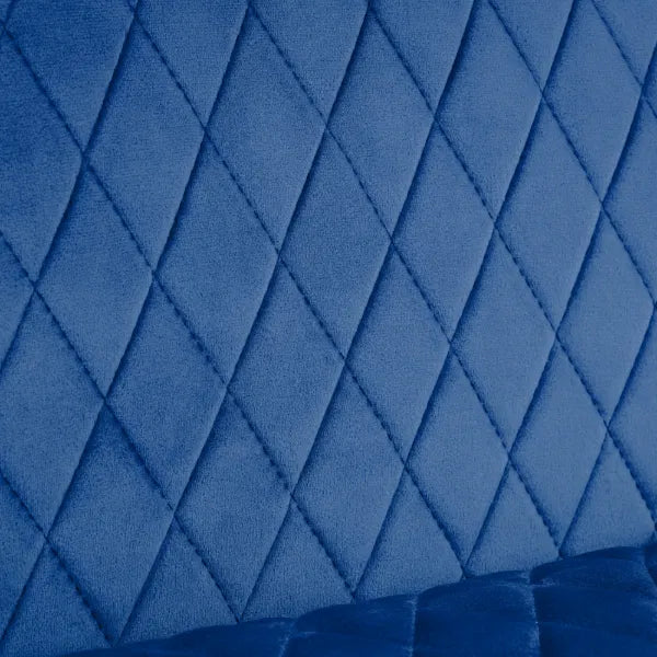 Close-up of blue quilted fabric with diamond pattern
