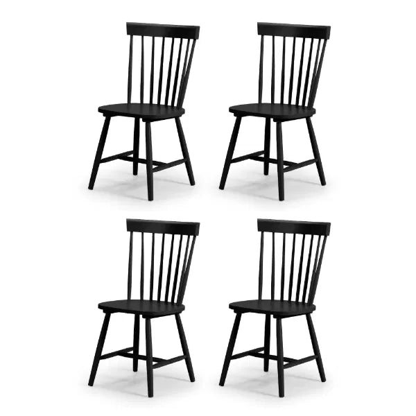 Four black wooden chairs on a white background