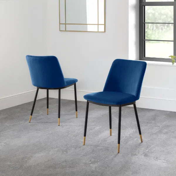 Two blue chairs with black legs on a gray floor.