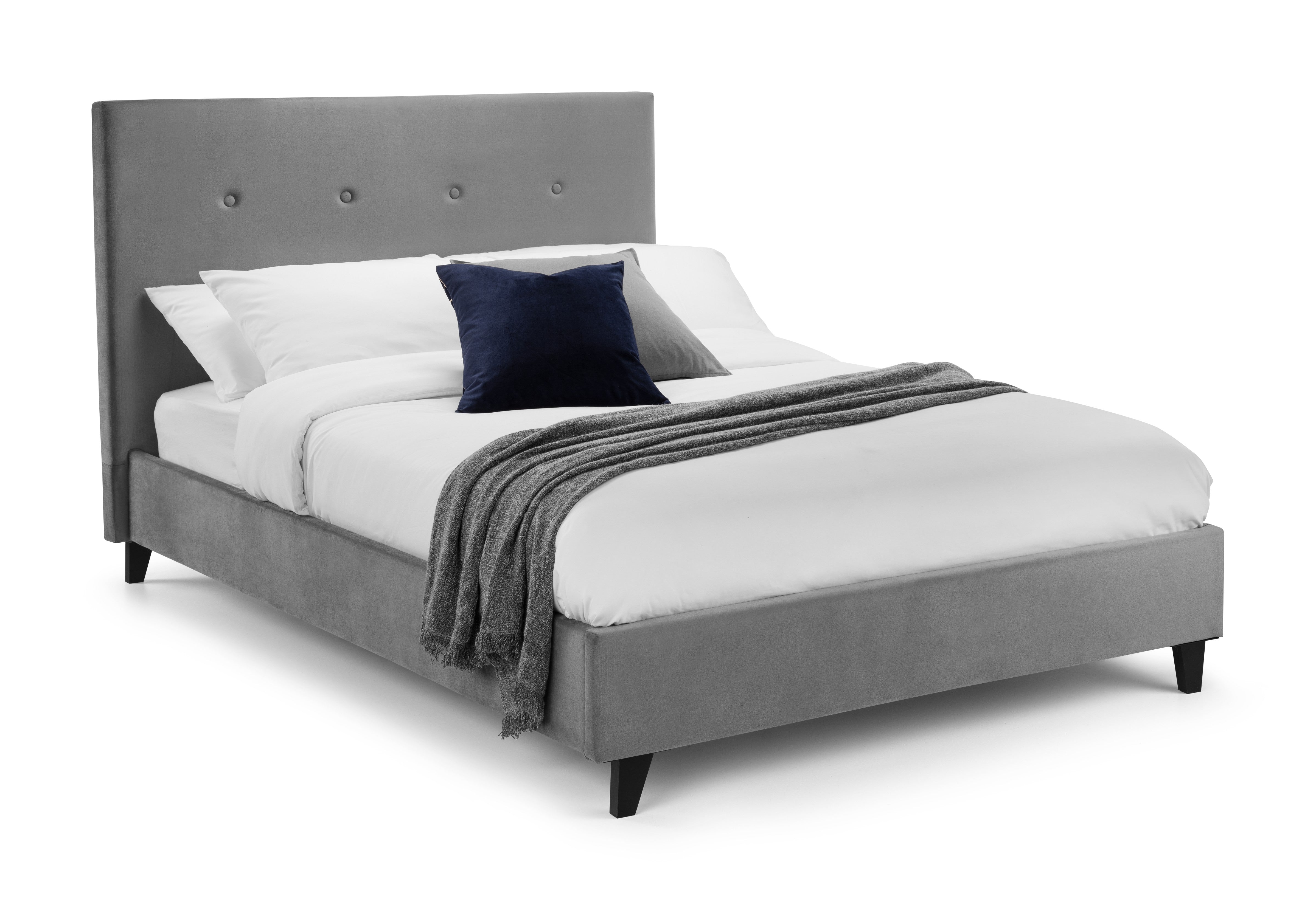 Gray upholstered bed with white bedding and a blue pillow on a white background