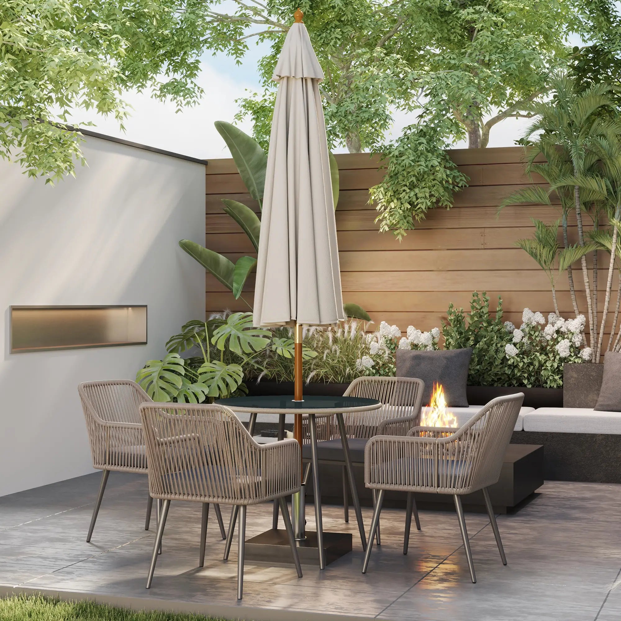 Outdoor patio setting with chairs, table, umbrella, and fire pit surrounded by plants and a wooden wall.
