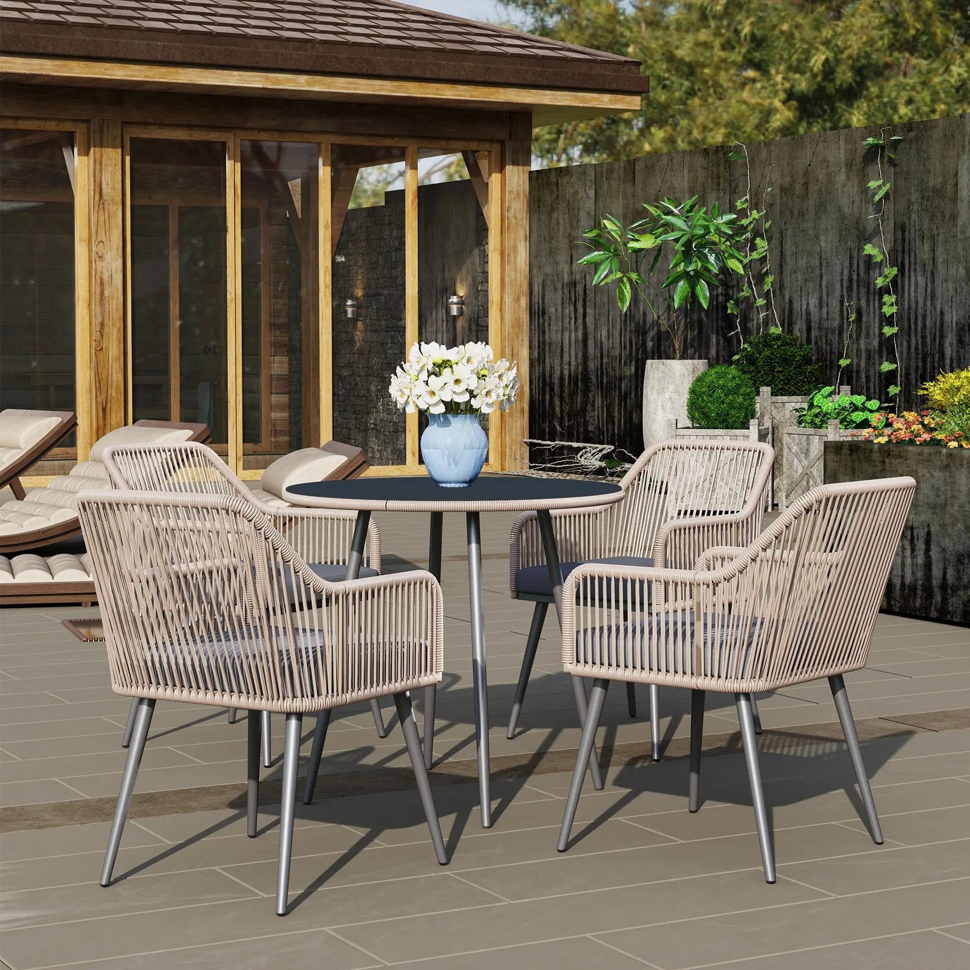Outdoor patio set with table and chairs on a deck