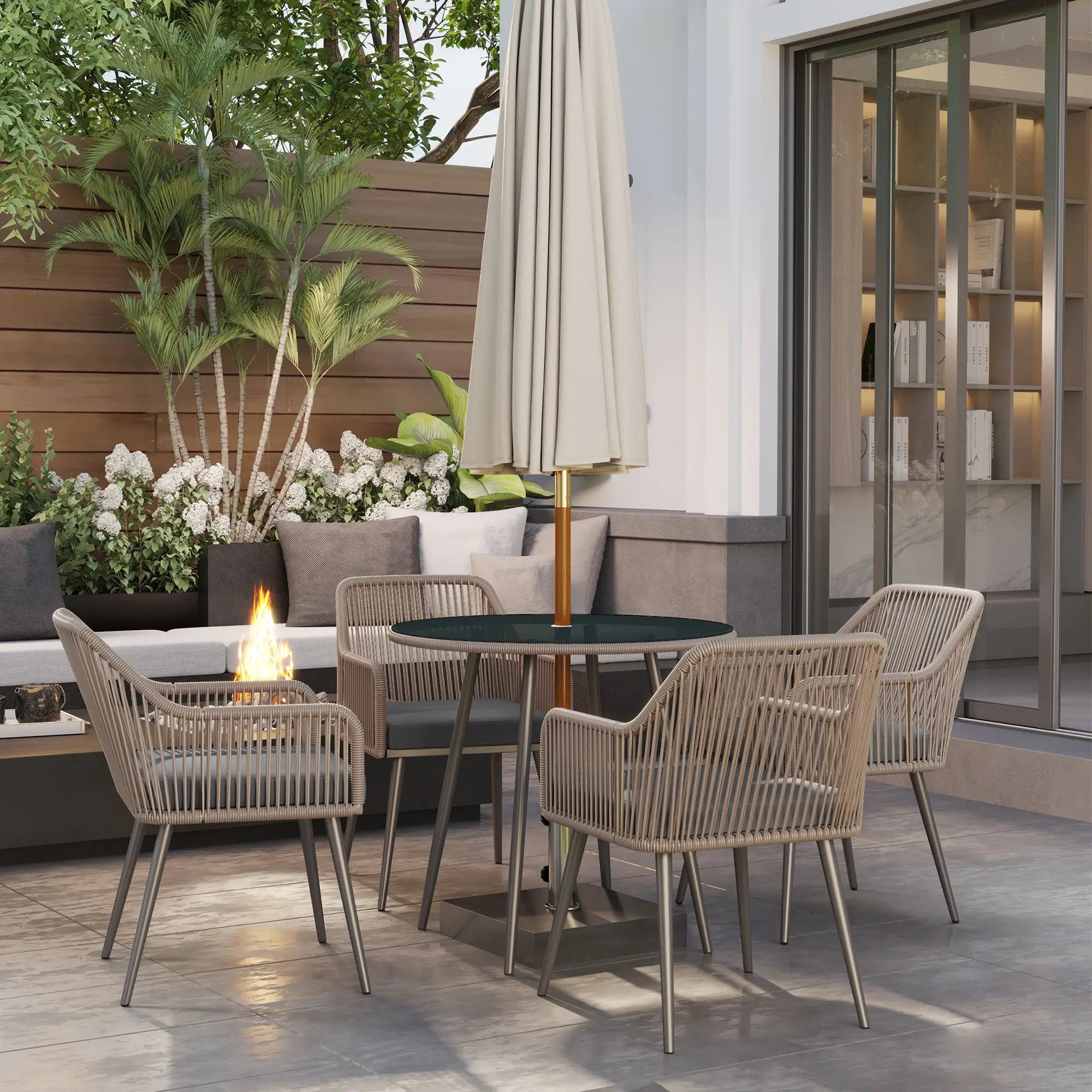 Outdoor patio set with chairs, table, and umbrella on a wooden deck.