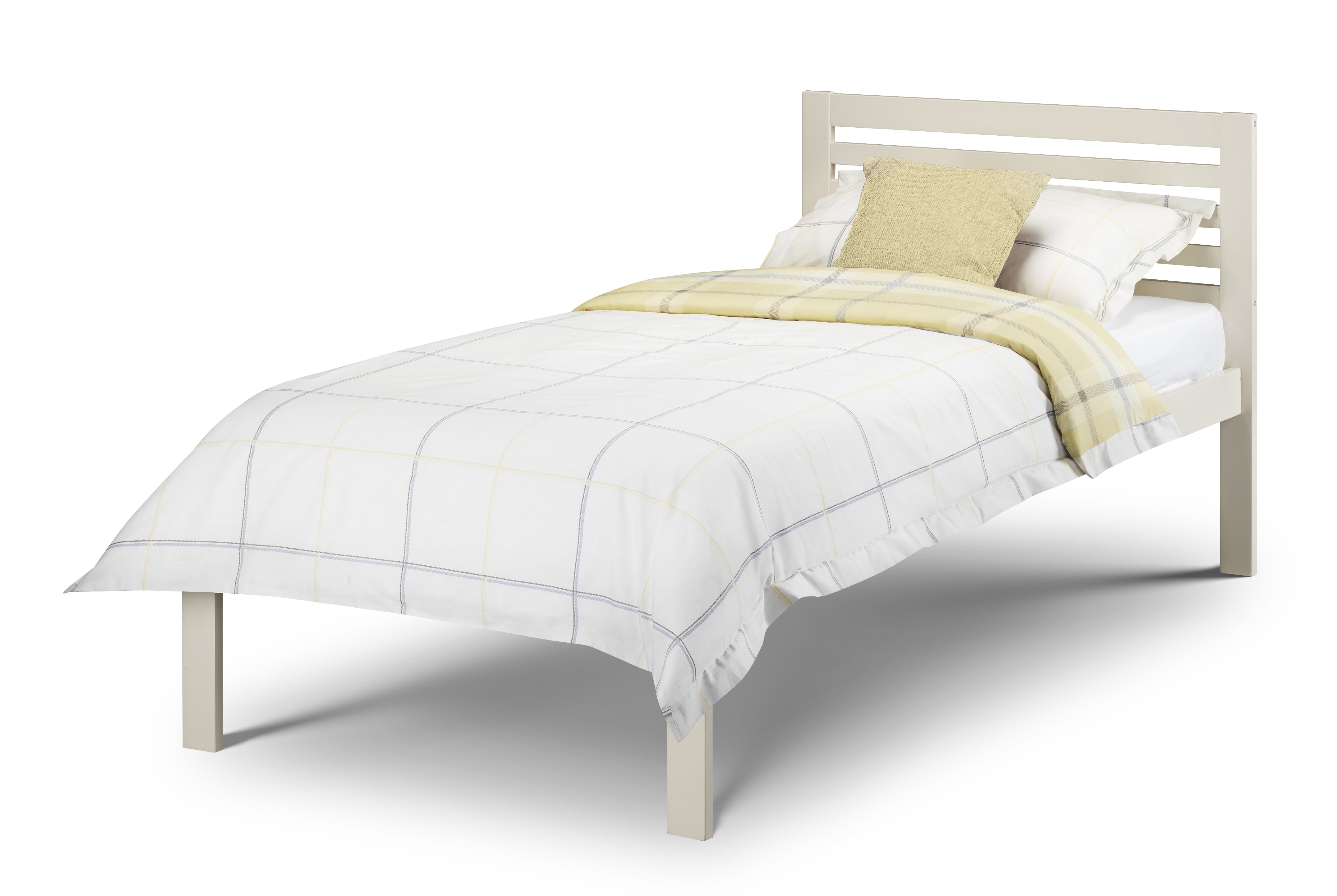 White bed with yellow blanket and pillows on a white background