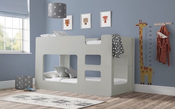 Children's bedroom with a gray bunk bed, rug, and wall decorations.