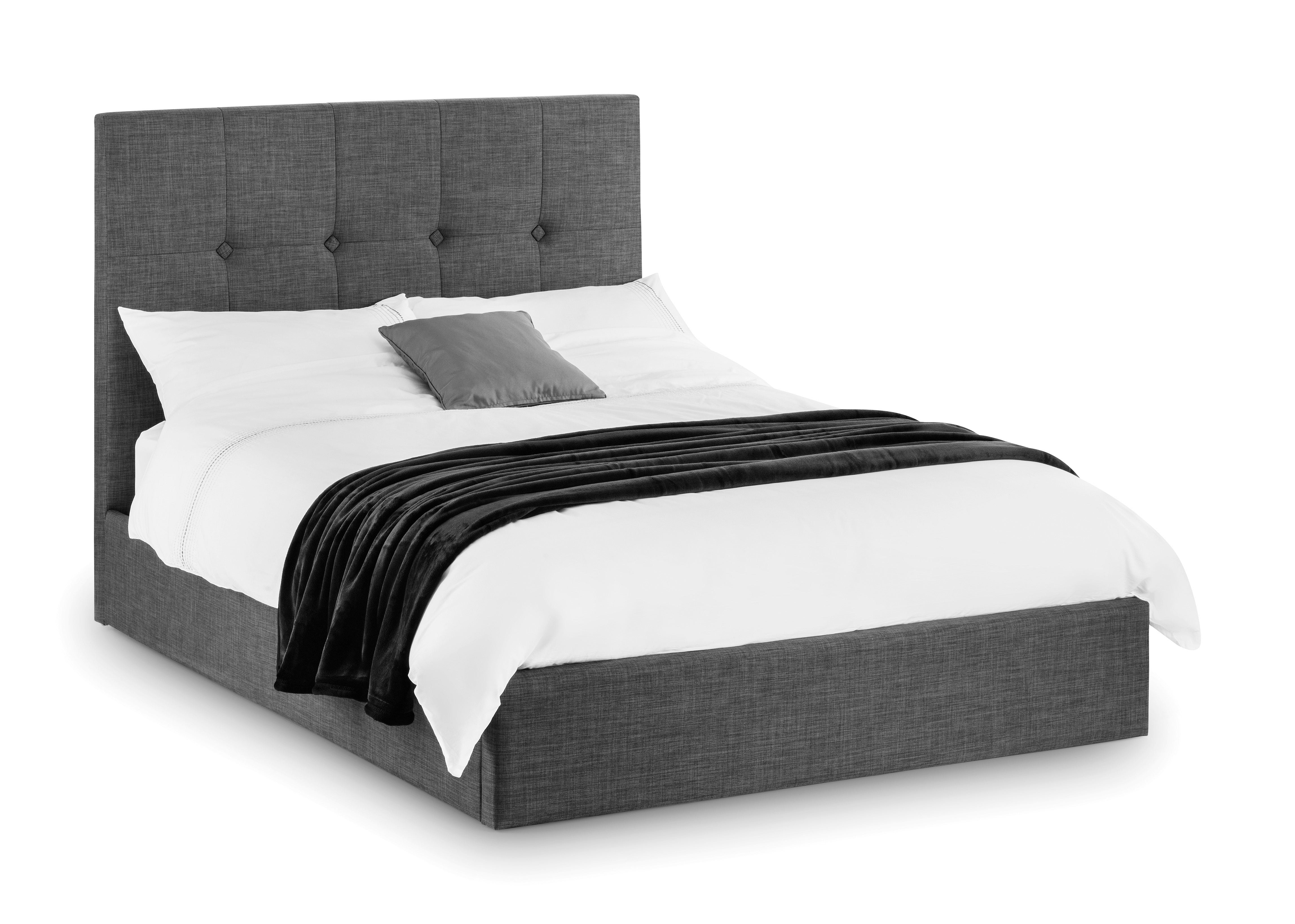 Bed with dark upholstered headboard and white bedding on a white background