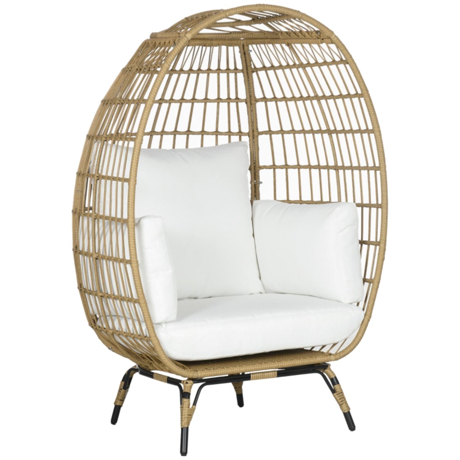 Wicker egg-shaped chair with white cushions on a white background