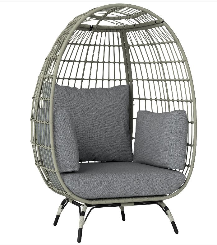 Egg-shaped wicker chair with gray cushions on a white background