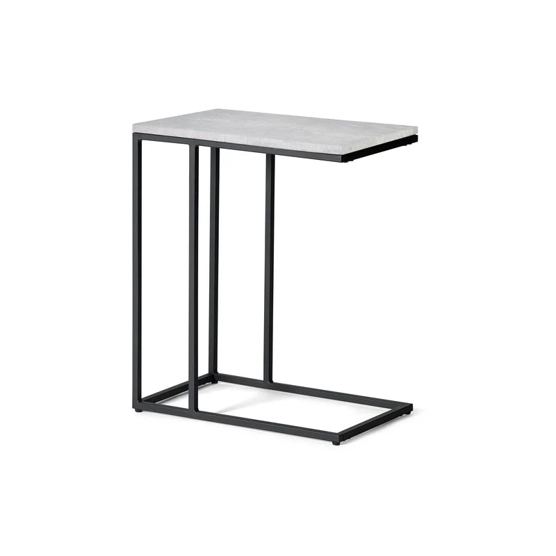 Small table with a white marble top and black metal frame on a white background