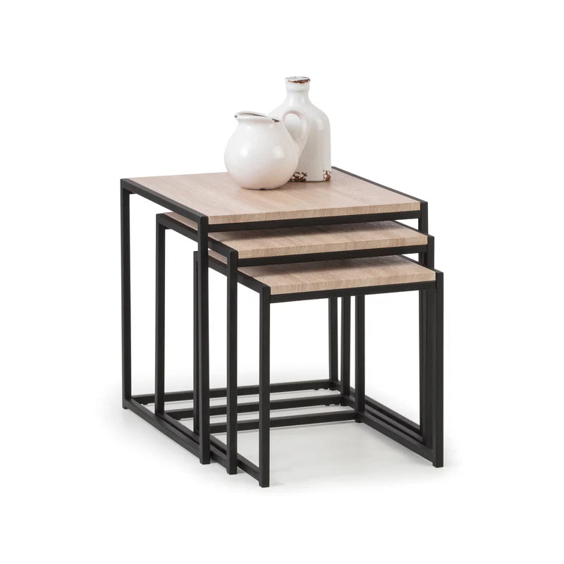 Set of three nesting tables with wooden tops and black metal frames on a white background.