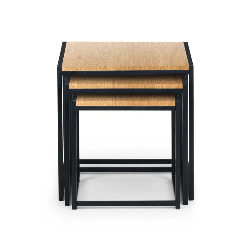 Set of three nesting tables with wooden tops and black metal frames on a white background