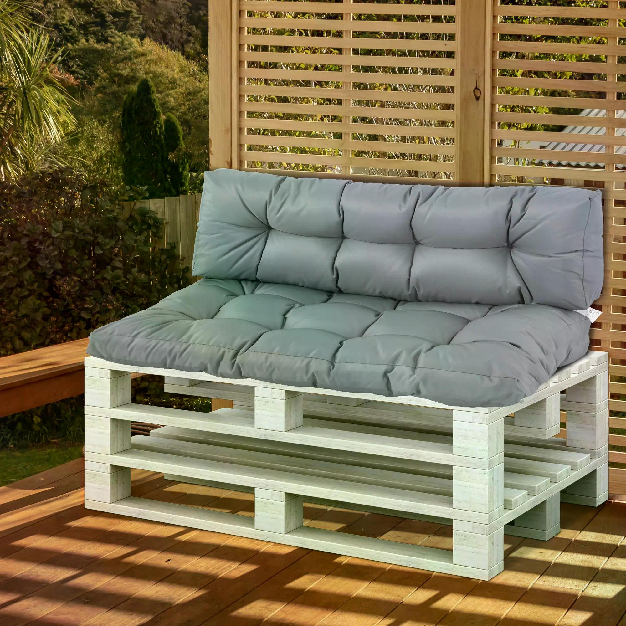Wooden pallet bench with gray cushions on a wooden deck