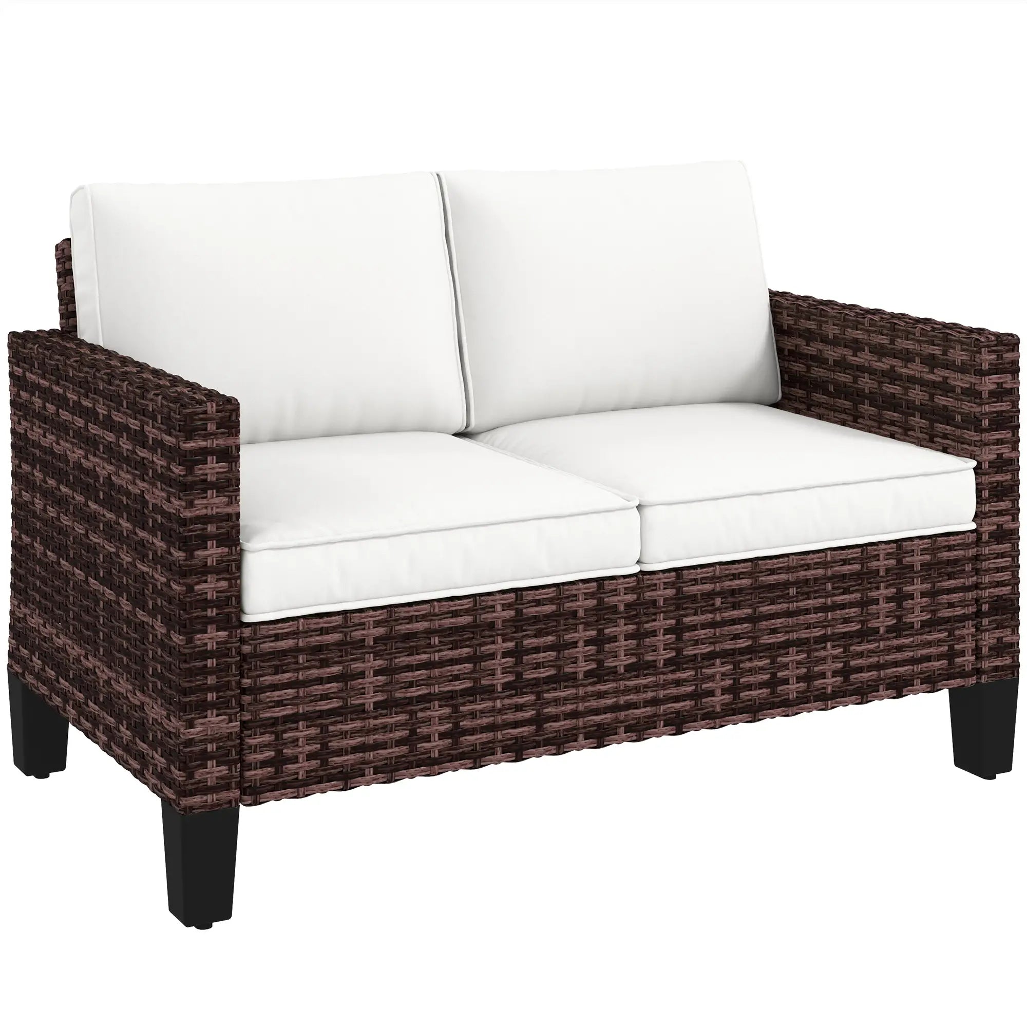 Brown wicker outdoor sofa with white cushions on a white background