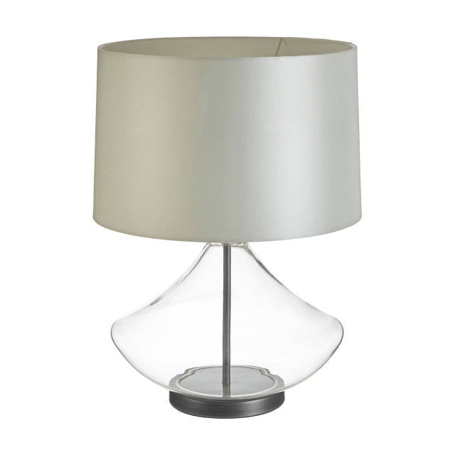 Table lamp with a beige shade and clear glass base on a white background