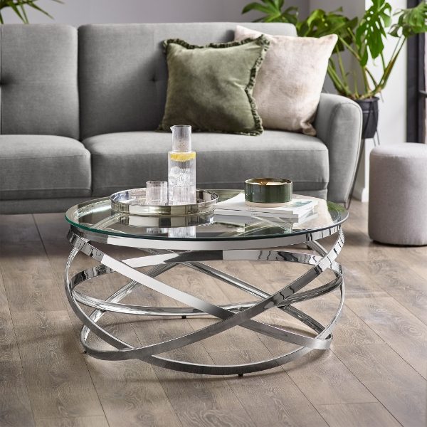 Modern living room with a glass coffee table and gray sofa