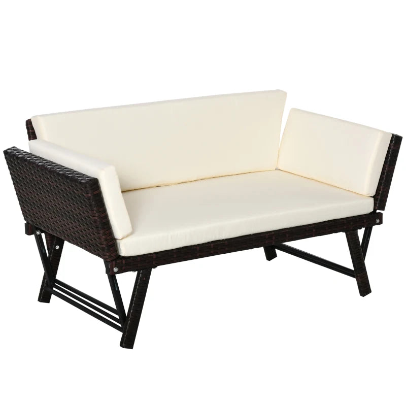 Wicker outdoor sofa with white cushions on a white background