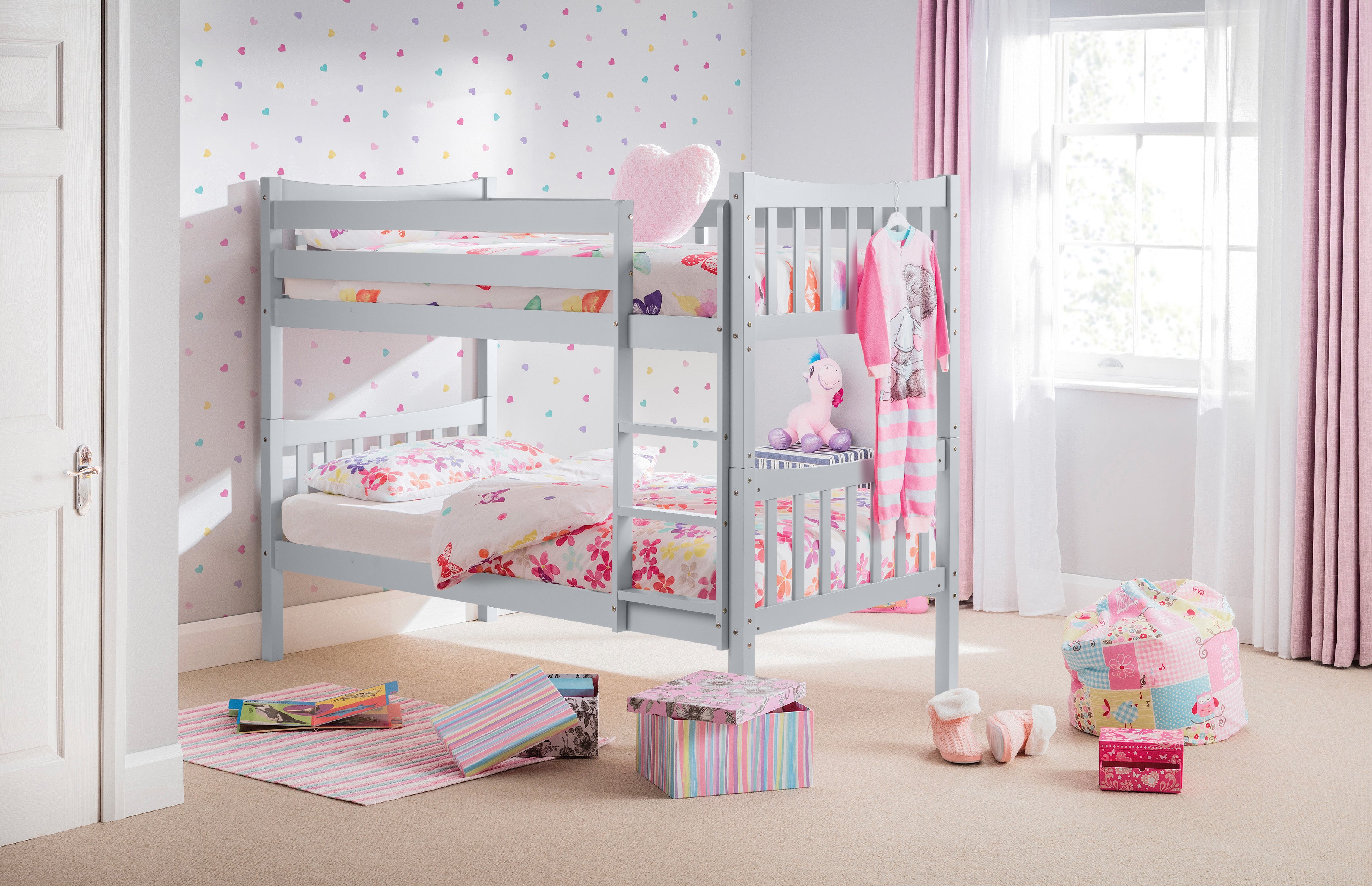Children's room with a gray bunk bed and colorful bedding.